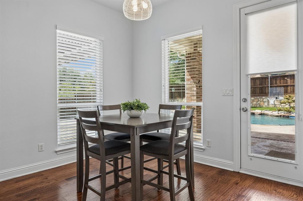1011 Three Rivers Drive Prosper, TX 75078 - Photo 25 of 27 a view of a dining room with furniture and wooden floor