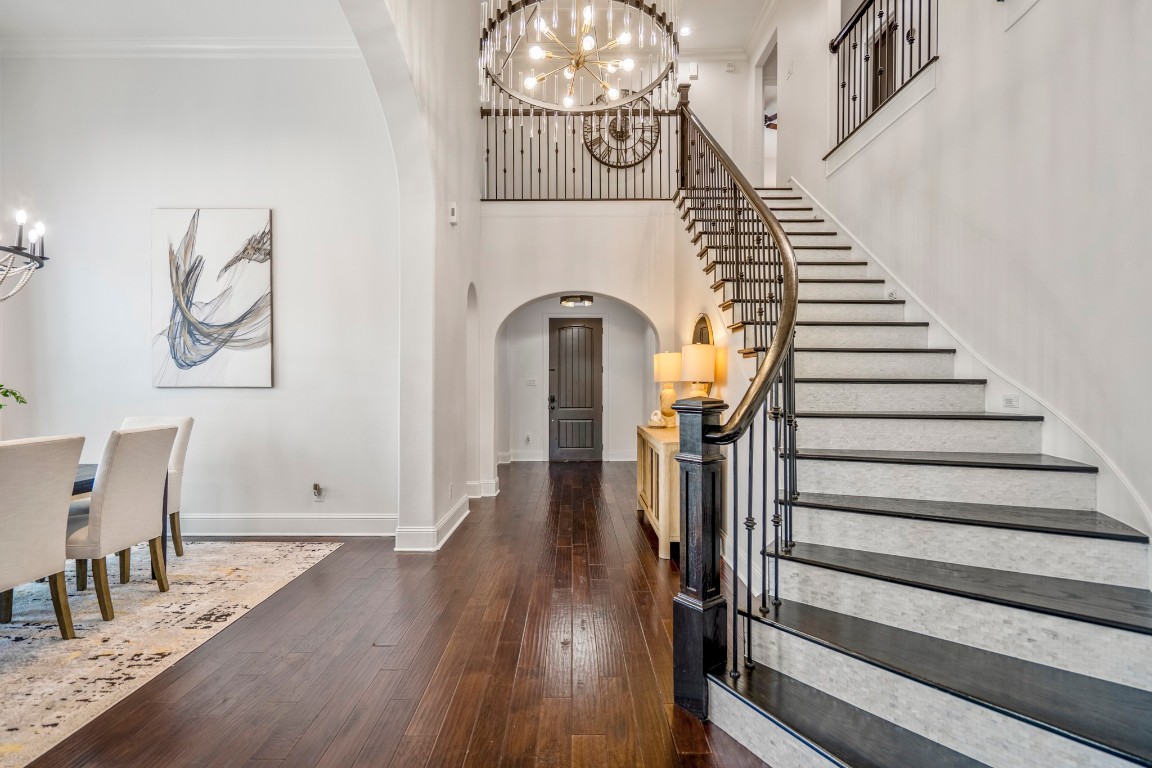 39 Beacons Light Place Tomball, TX 77375 - Photo 9 of 50 Mother of pearl tiled risers on staircase and new wood/stained treads.
