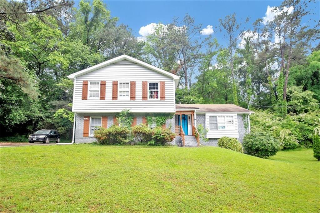 4429 Luxembourg Way Decatur, GA 30034 - Photo 1 of 1 a front view of a house with garden