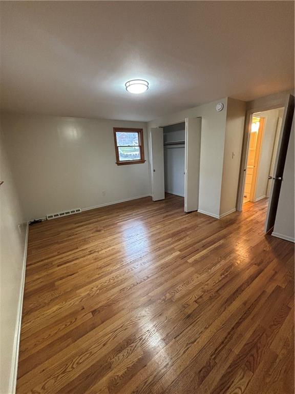 9072 Ringeisen Road Allison Park, PA 15101 - Photo 21 of 30 an empty room with wooden floor and windows