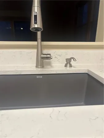 a close view of sink and kitchen island