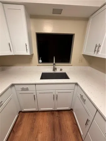 a kitchen with a sink and a microwave