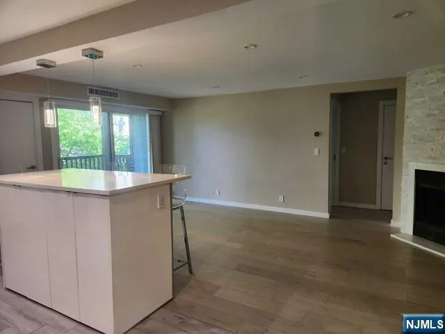 a view of kitchen with furniture and fireplace