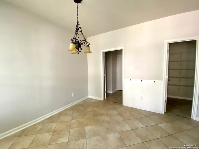 a view of a room with cabinet and a window