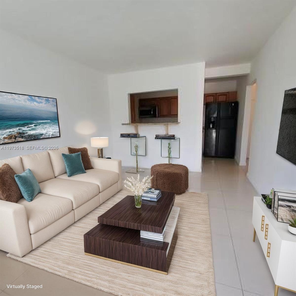 1845 Pembroke Road, Unit 322 Hollywood, FL 33020 - Photo 1 of 11 a living room with furniture and a flat screen tv