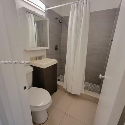 1845 Pembroke Road, Unit 322 Hollywood, FL 33020 - Photo 9 of 11 a bathroom with a sink and a mirror