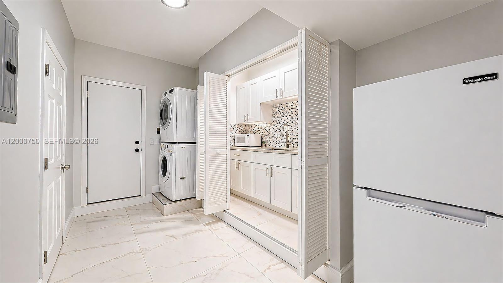 16247 Southwest 92nd Terrace, Unit B Miami, FL 33196 - Photo 11 of 17 a view of kitchen with refrigerator and wooden floor