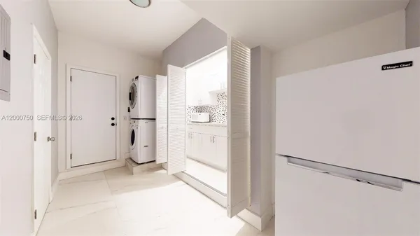 a view of a storage & utility room with washer and dryer