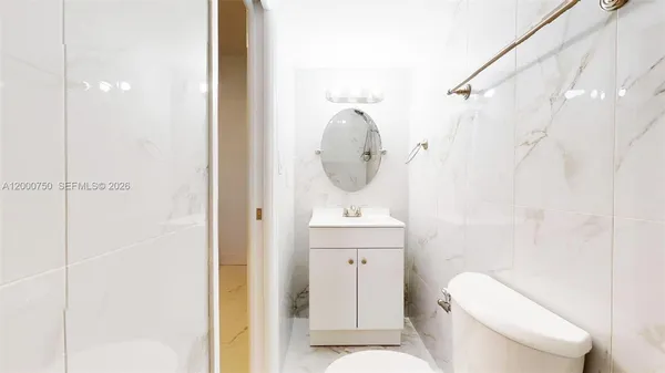 a bathroom with a shower and toilet