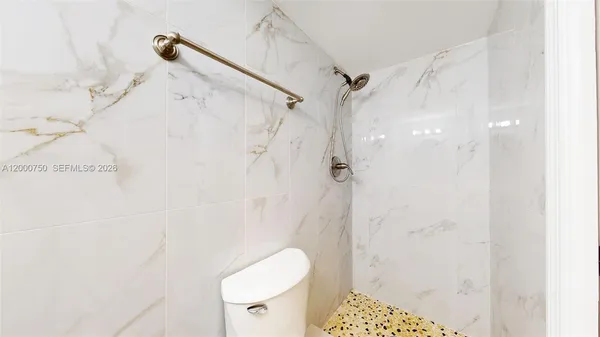 a bathroom with a sink and a white cabinets
