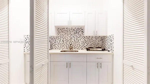 a view of a bathroom with a shower and closet