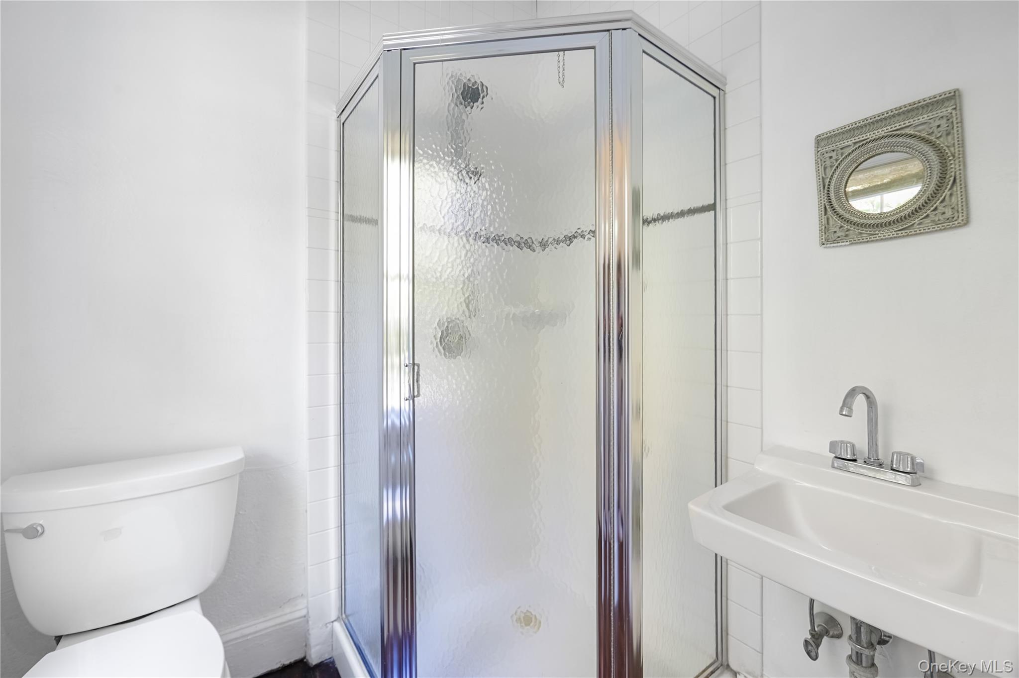 25 Whittier Road Blauvelt, NY 10913 - Photo 16 of 34 a white toilet sitting next to a bathroom sink