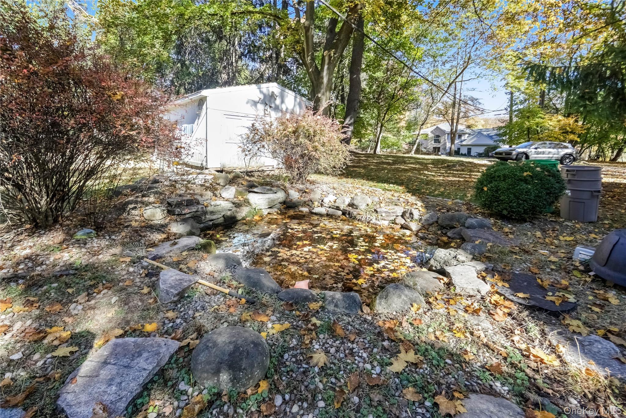 25 Whittier Road Blauvelt, NY 10913 - Photo 31 of 34 View of yard featuring a small Koi pond and a storage unit