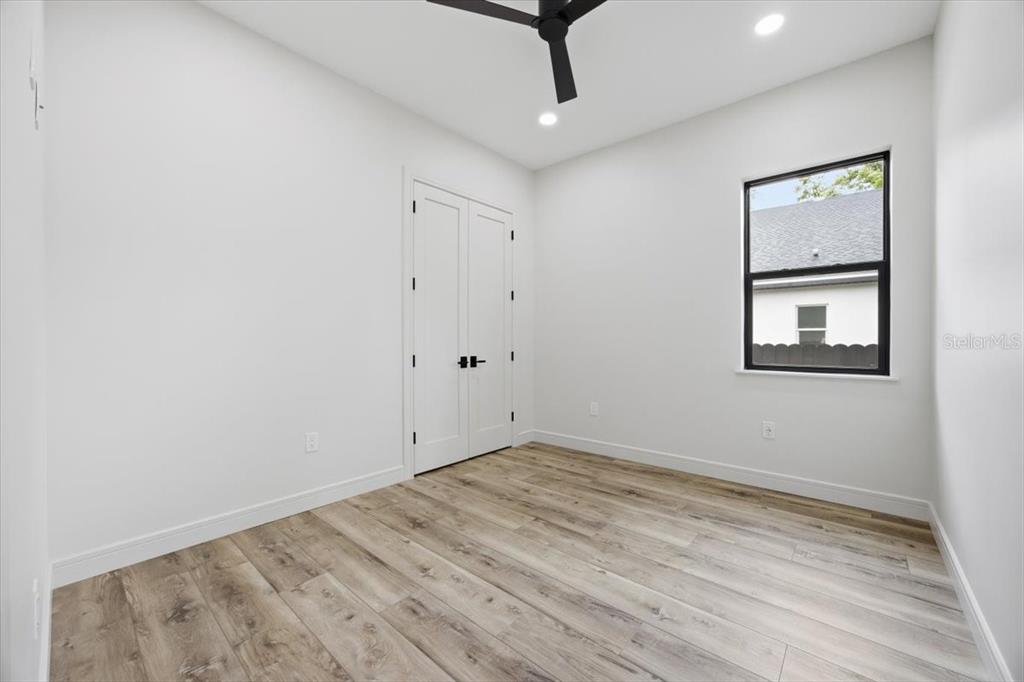 104 South Maki Road Plant City, FL 33563 - Photo 11 of 28 a view of empty room with wooden floor