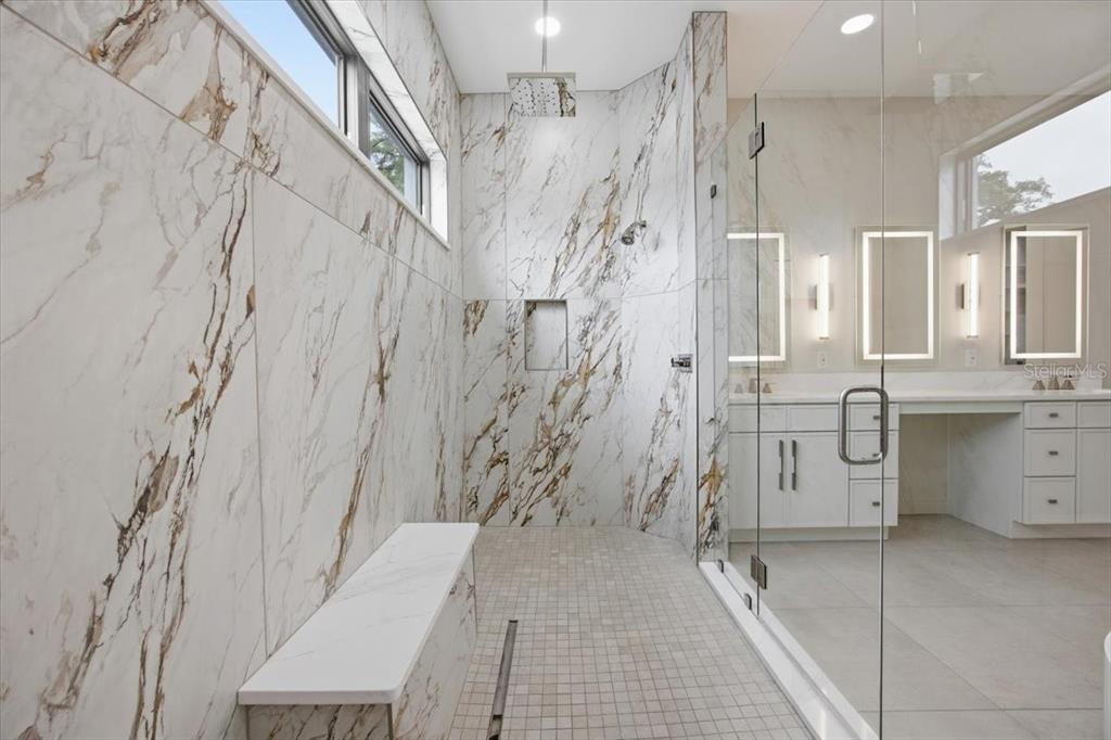 104 South Maki Road Plant City, FL 33563 - Photo 12 of 28 a bathroom with a shower and a sink