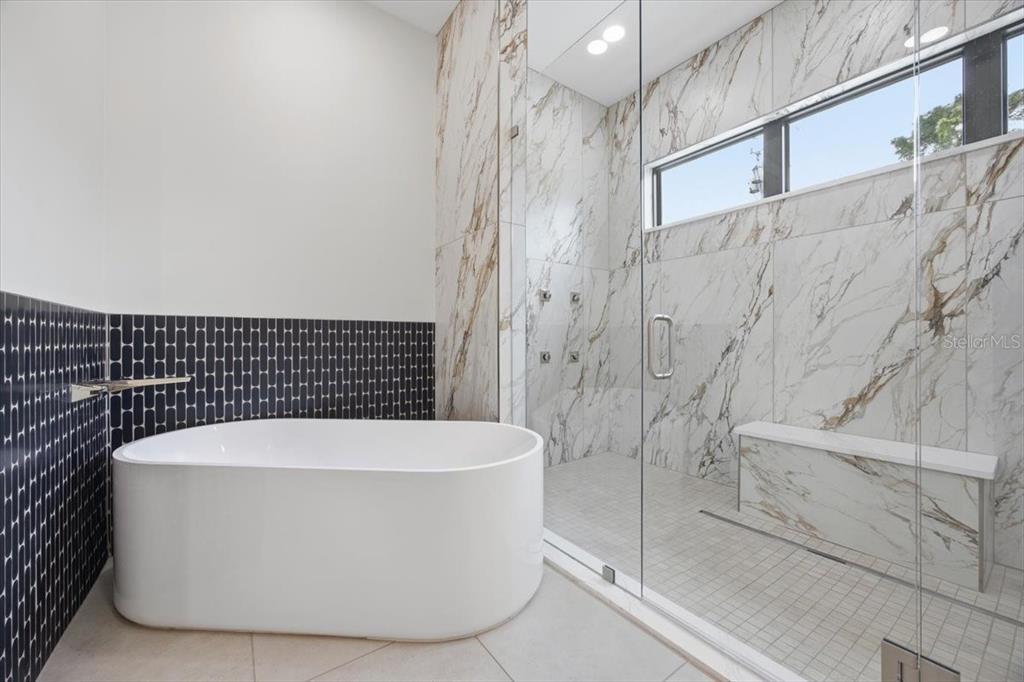 104 South Maki Road Plant City, FL 33563 - Photo 13 of 28 a white bath tub sitting in a bathroom