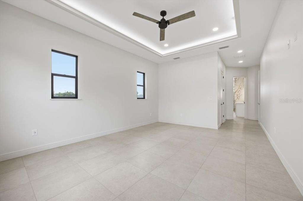104 South Maki Road Plant City, FL 33563 - Photo 19 of 28 an empty room with a ceiling fan and a window