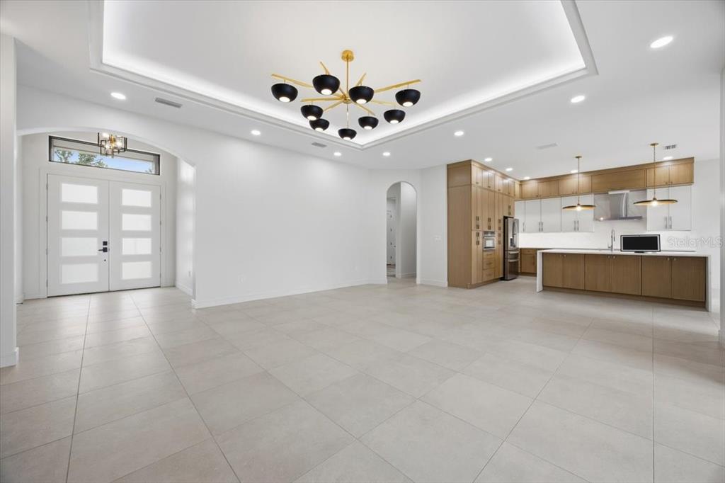 104 South Maki Road Plant City, FL 33563 - Photo 5 of 28 a view of a kitchen with cabinet and a chandelier