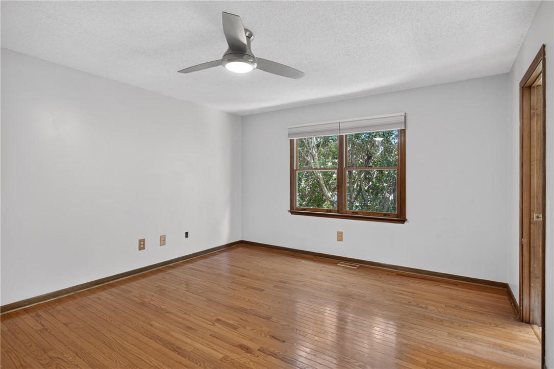 103 Dorsey Lane Walhalla, SC 29691 - Photo 15 of 42 Hardwood floors and a verdant outdoor view define this airy bedroom.