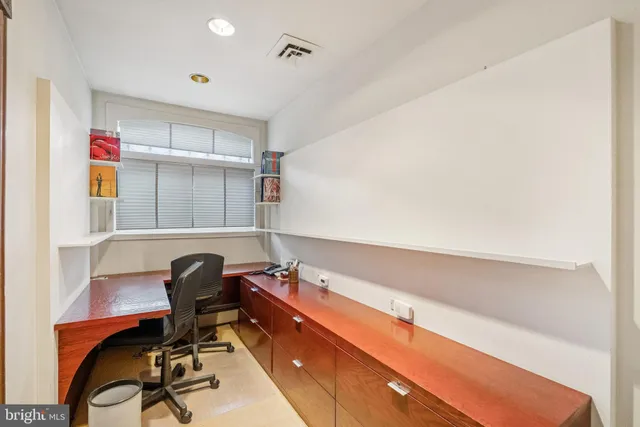 a view of balcony with wooden floor and outdoor seating