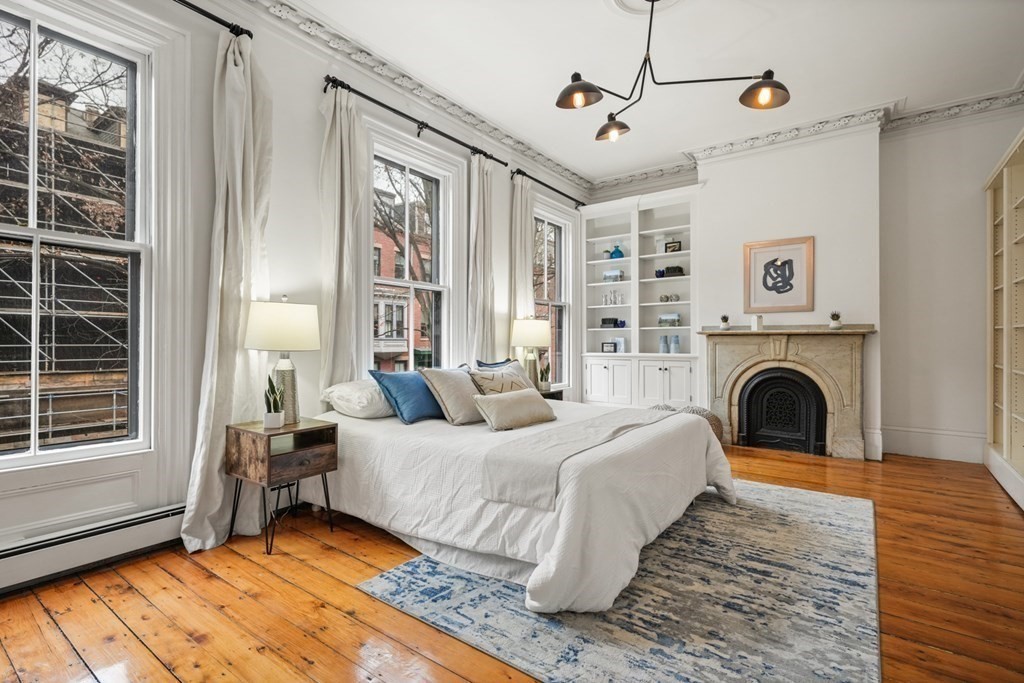 33 East Springfield Street, Unit 1 Boston, MA 02118 - Photo 1 of 31 a bedroom with a bed and a fireplace
