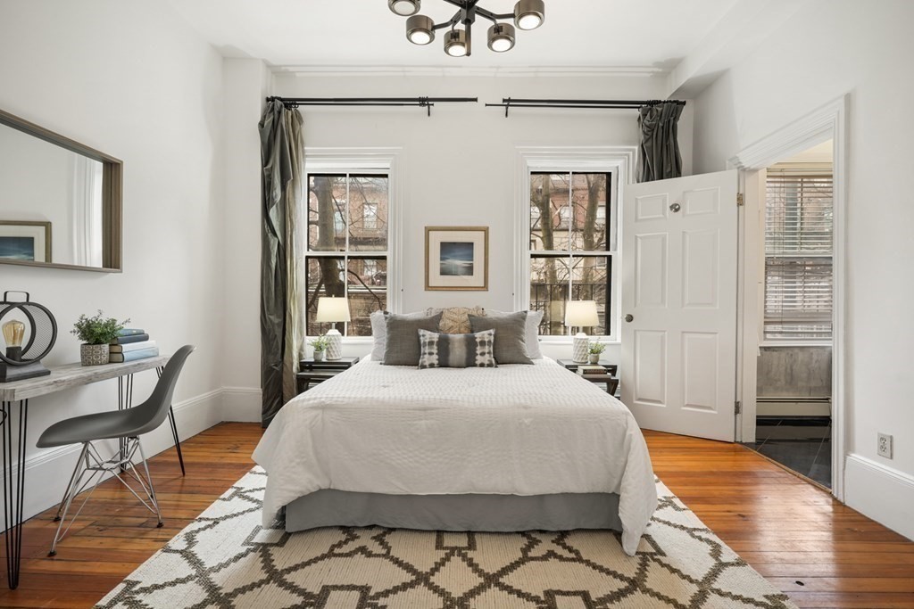 33 East Springfield Street, Unit 1 Boston, MA 02118 - Photo 14 of 31 a bedroom with a large bed and a chandelier