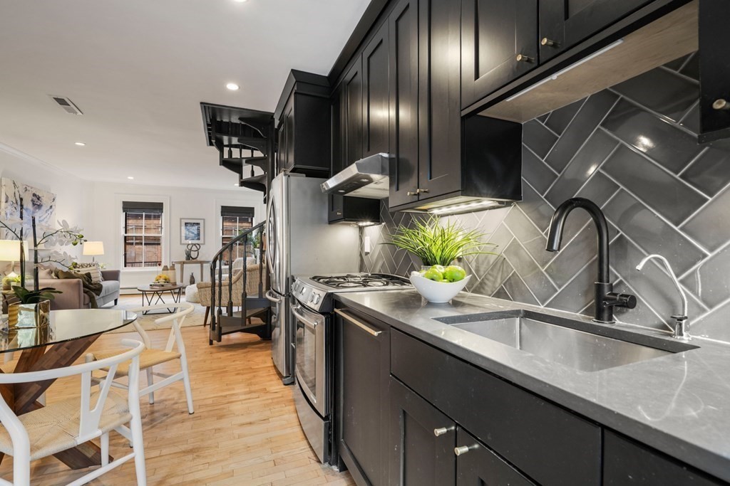 33 East Springfield Street, Unit 1 Boston, MA 02118 - Photo 27 of 31 a kitchen with stainless steel appliances granite countertop a sink a stove and a refrigerator