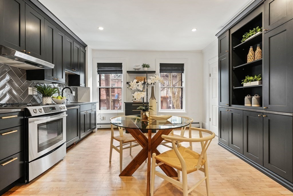 33 East Springfield Street, Unit 1 Boston, MA 02118 - Photo 7 of 31 a view of a dining room with furniture and a kitchen