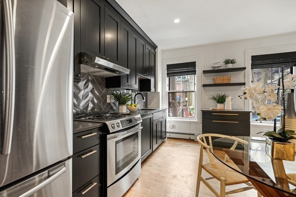 33 East Springfield Street, Unit 1 Boston, MA 02118 - Photo 8 of 31 a kitchen with stainless steel appliances granite countertop a stove and a refrigerator