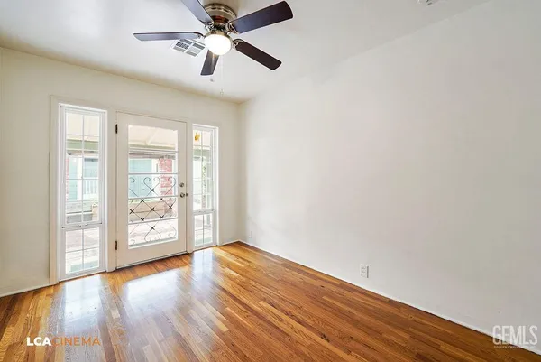 a kitchen with wooden floors and window