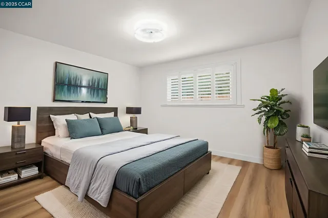 a bathroom with a granite countertop toilet sink and mirror