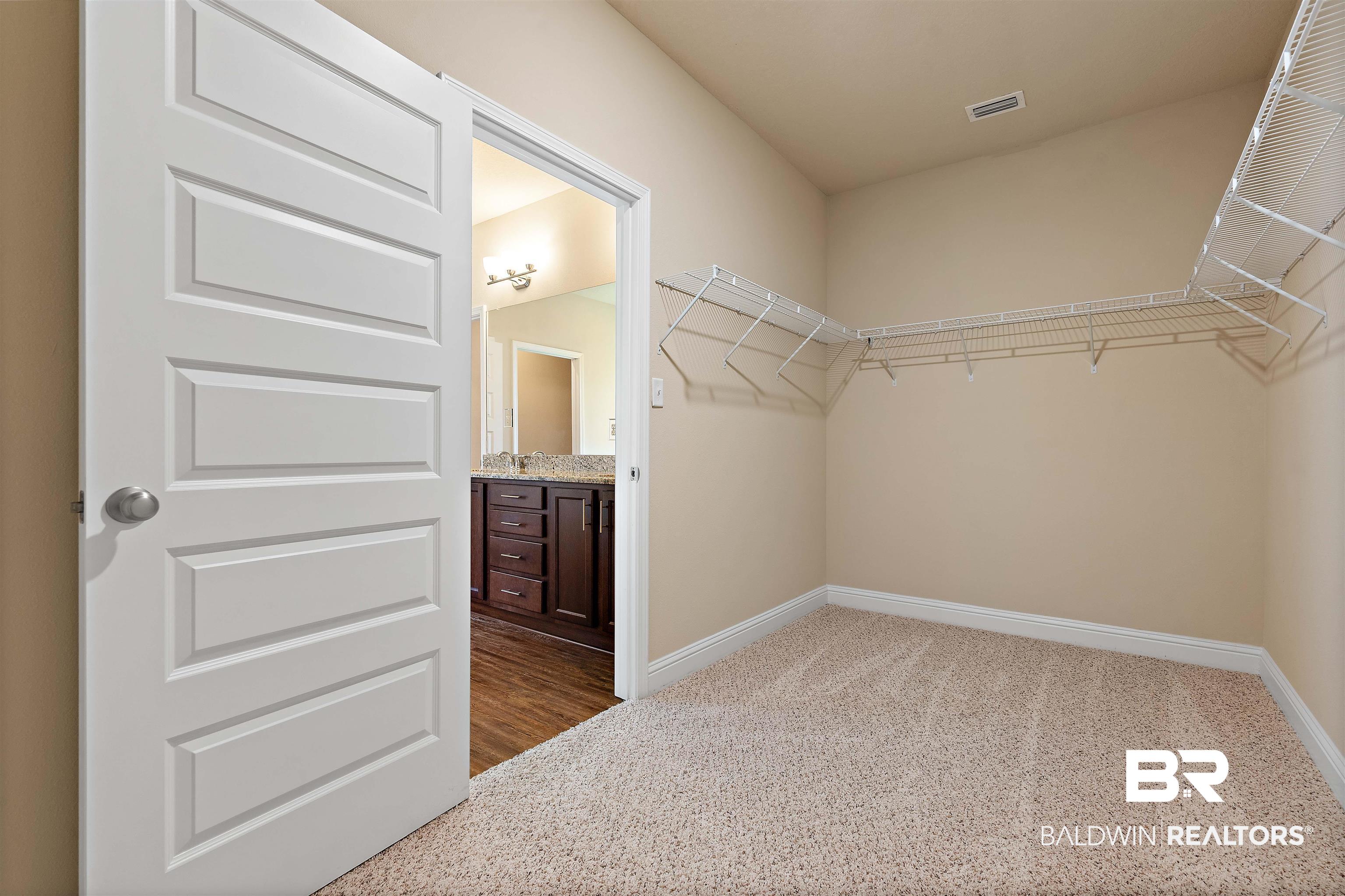 1864 Gwin Court Mobile, AL 36695 - Photo 24 of 37 Spacious closet featuring carpet floors and sink