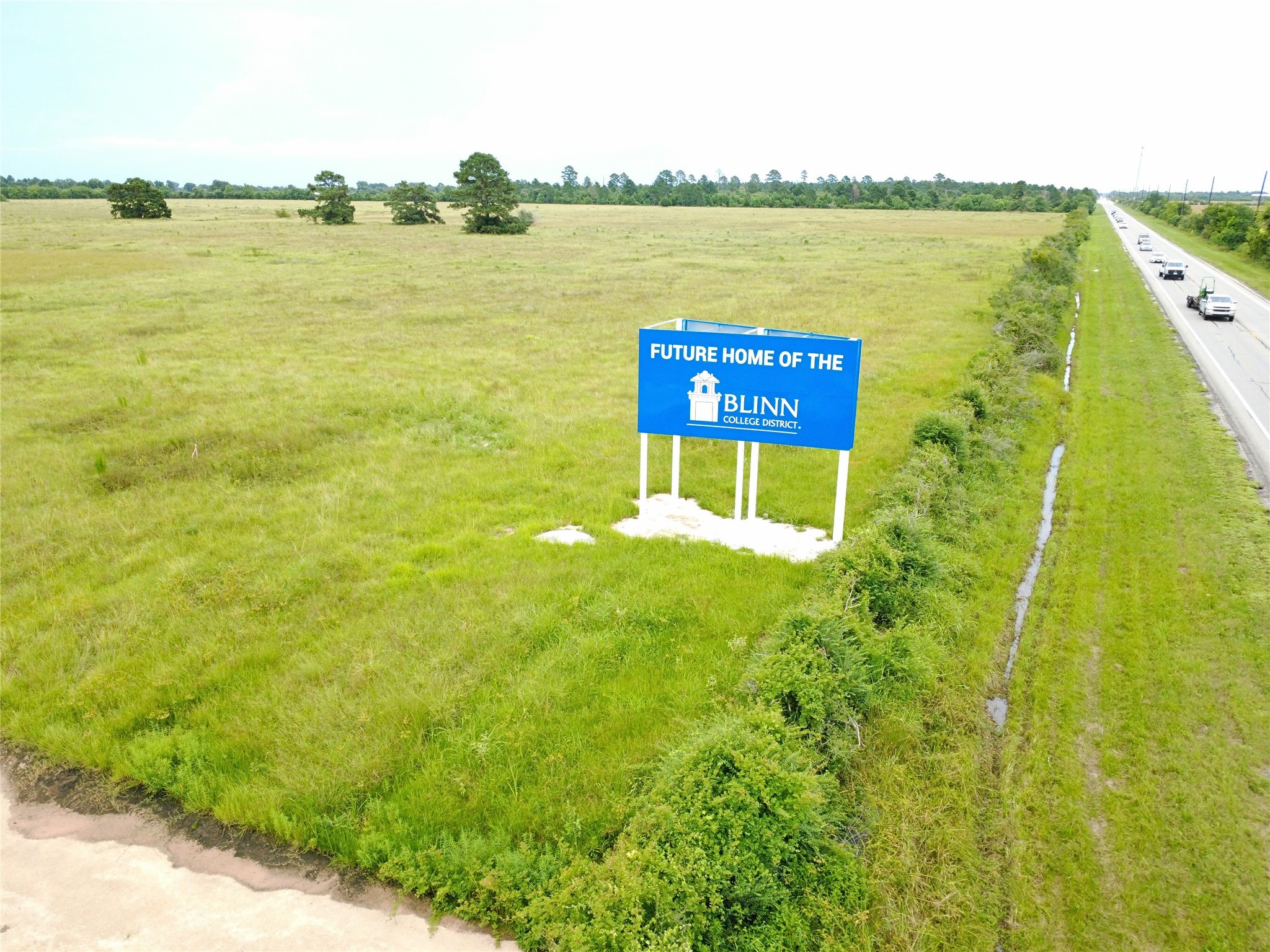 29927 Waller Spring Creek Road Waller, TX 77484 - Photo 8 of 8 a view of a lake with a building in the background
