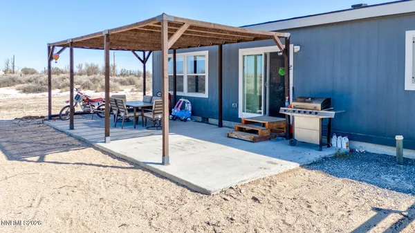a view of a backyard with sitting area