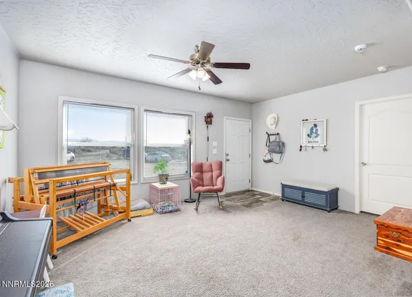 a bathroom with a sink a toilet and shower curtain