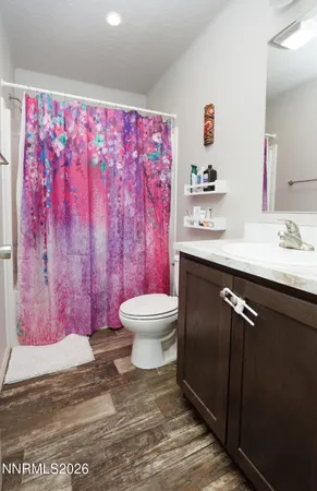 a bedroom with furniture and a book shelf