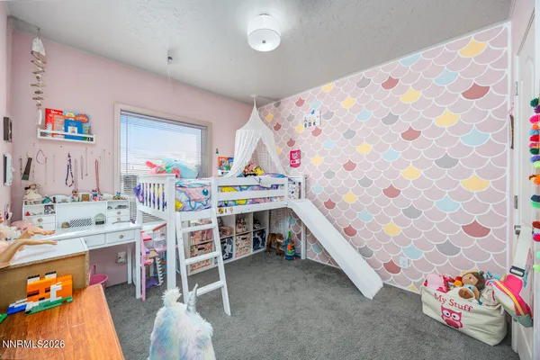 a bedroom with a bed and a table in it
