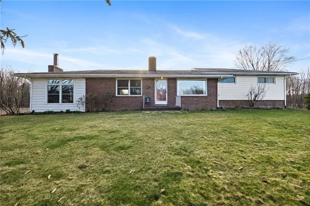 front view of a house with a yard