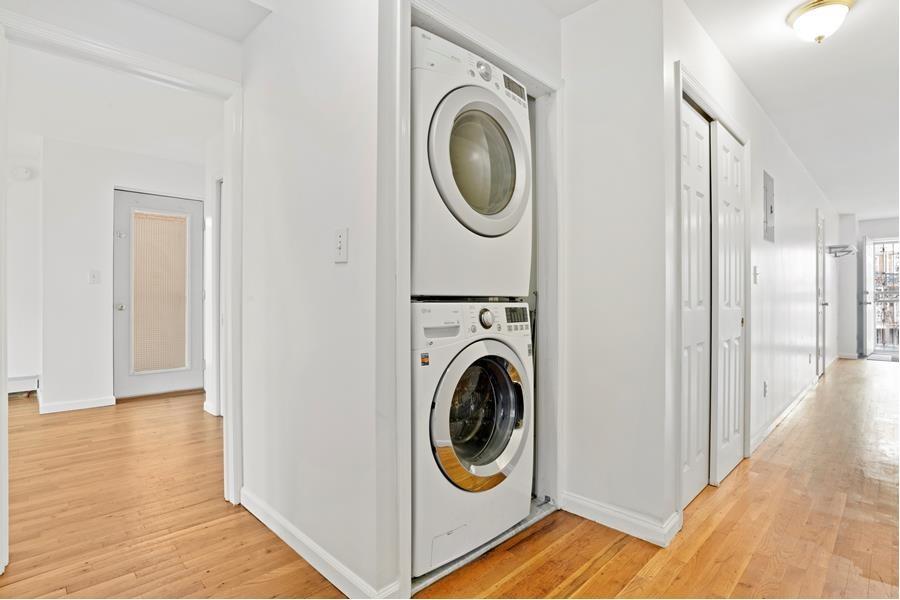 a view of a hallway with washer and dryer