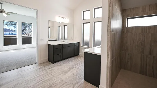 a view of a kitchen with a sink and a fireplace