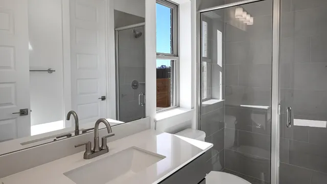 a view of a livingroom with a ceiling fan and window