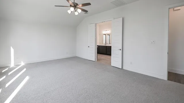 a view of a house with backyard and porch