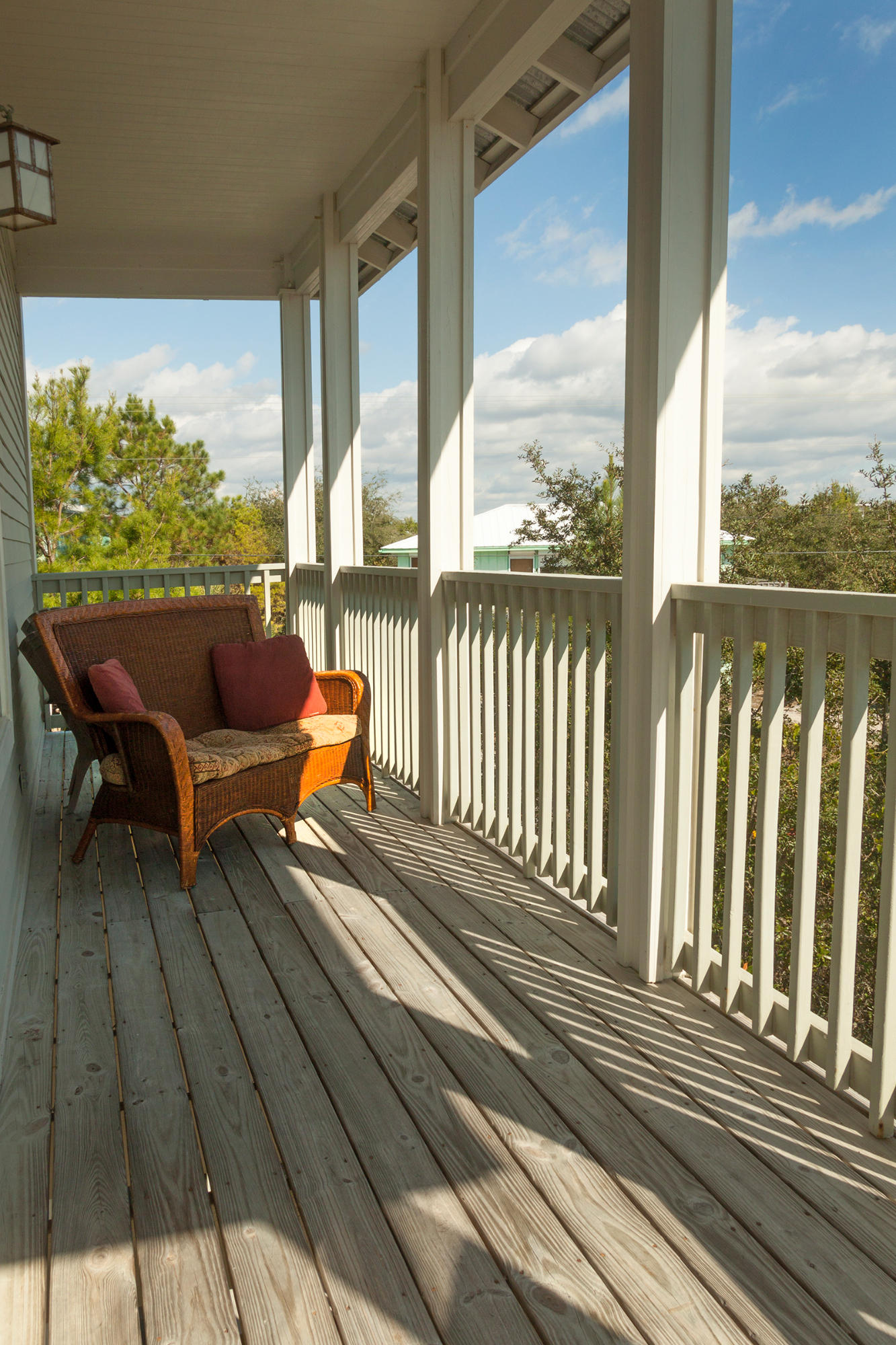 10 Chelsea Loop Road Santa Rosa Beach, FL 32459 - Photo 17 of 28 a balcony with wooden floor table and chairs