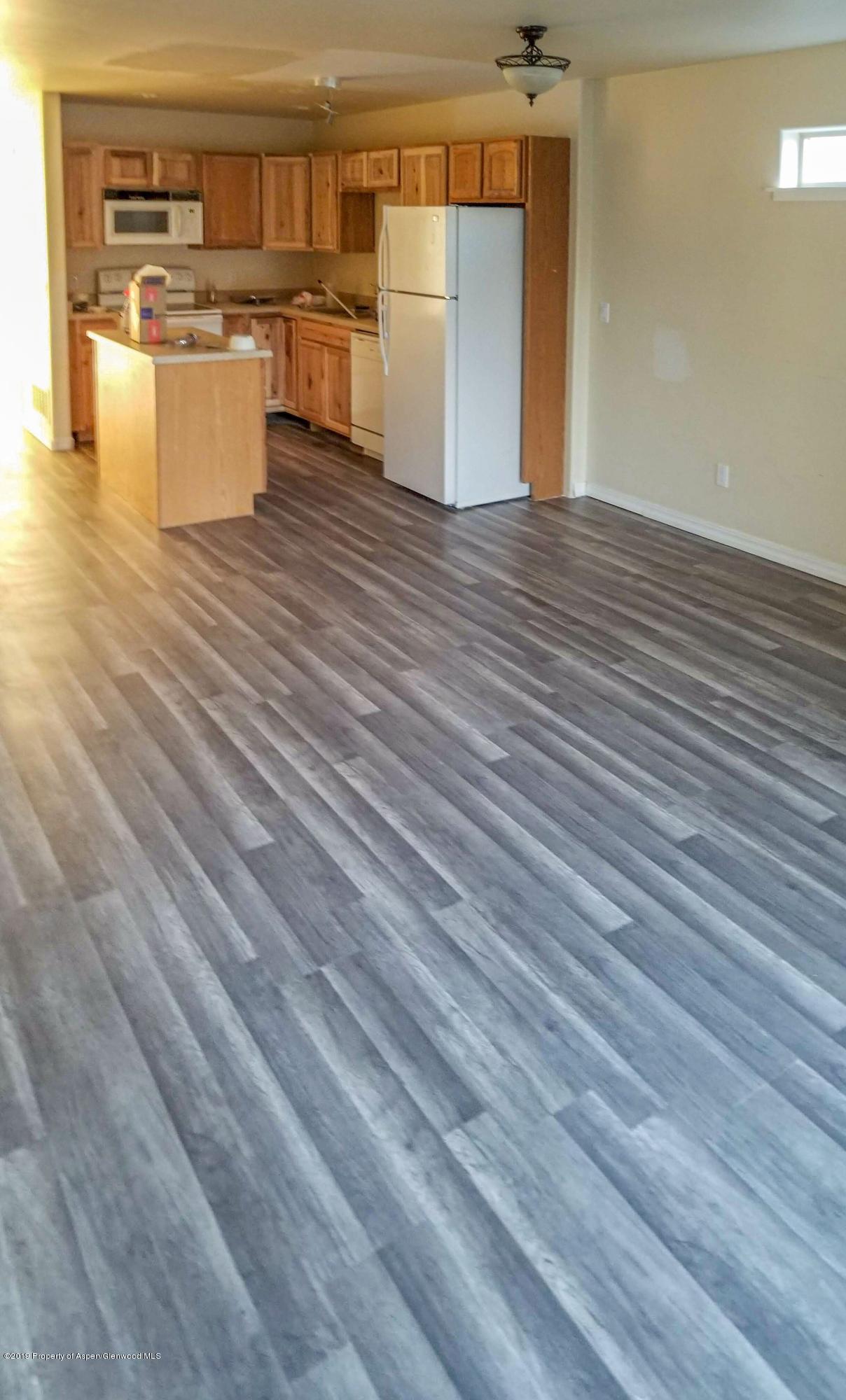 1016 East Avenue, Unit 4 Rifle, CO 81650 - Photo 2 of 12 great room and kitchen