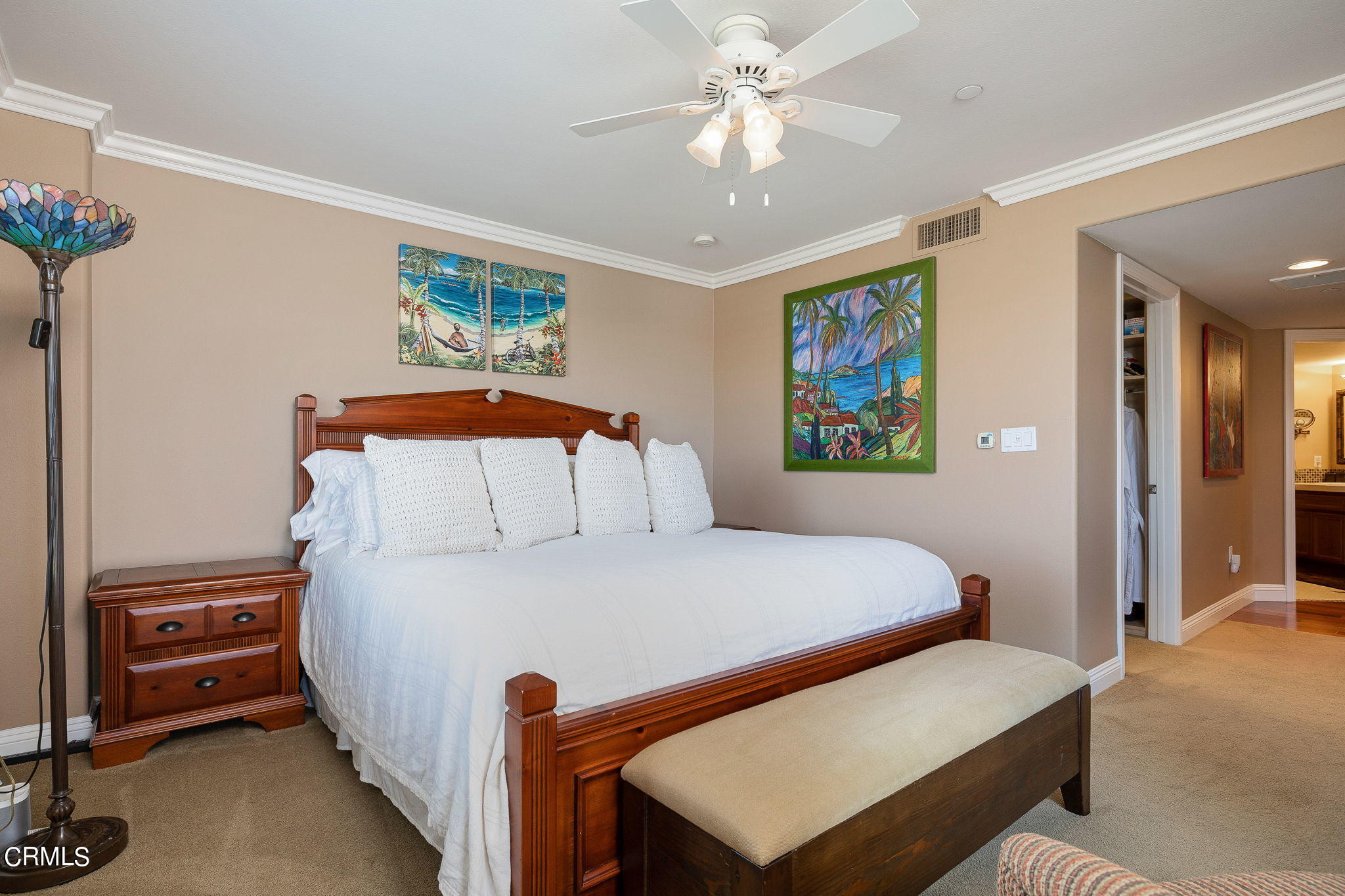 4288 Tradewinds Drive Oxnard, CA 93035 - Photo 21 of 42 a bedroom with a bed and a chandelier