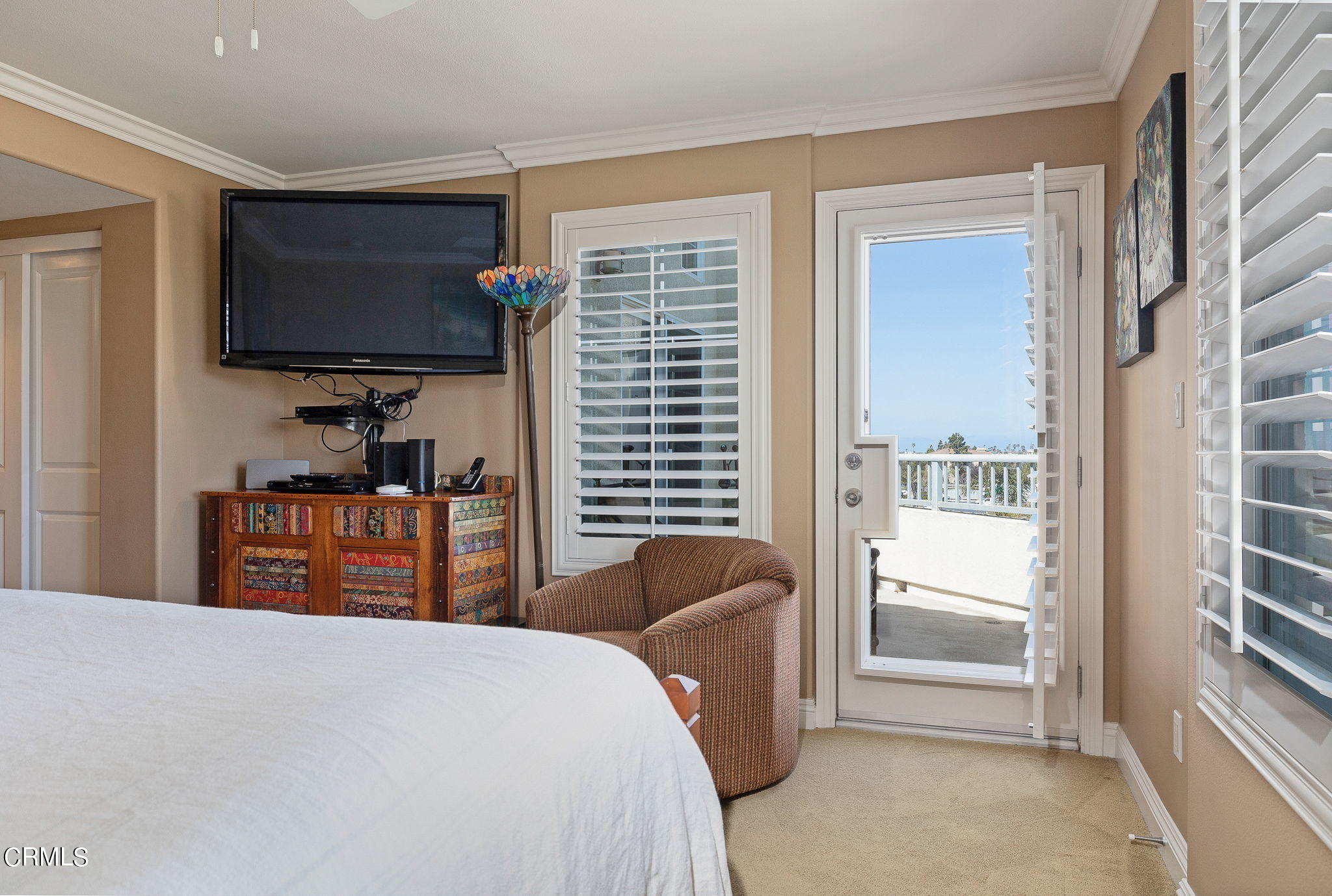 4288 Tradewinds Drive Oxnard, CA 93035 - Photo 22 of 42 a bedroom with a bed and a flat screen tv