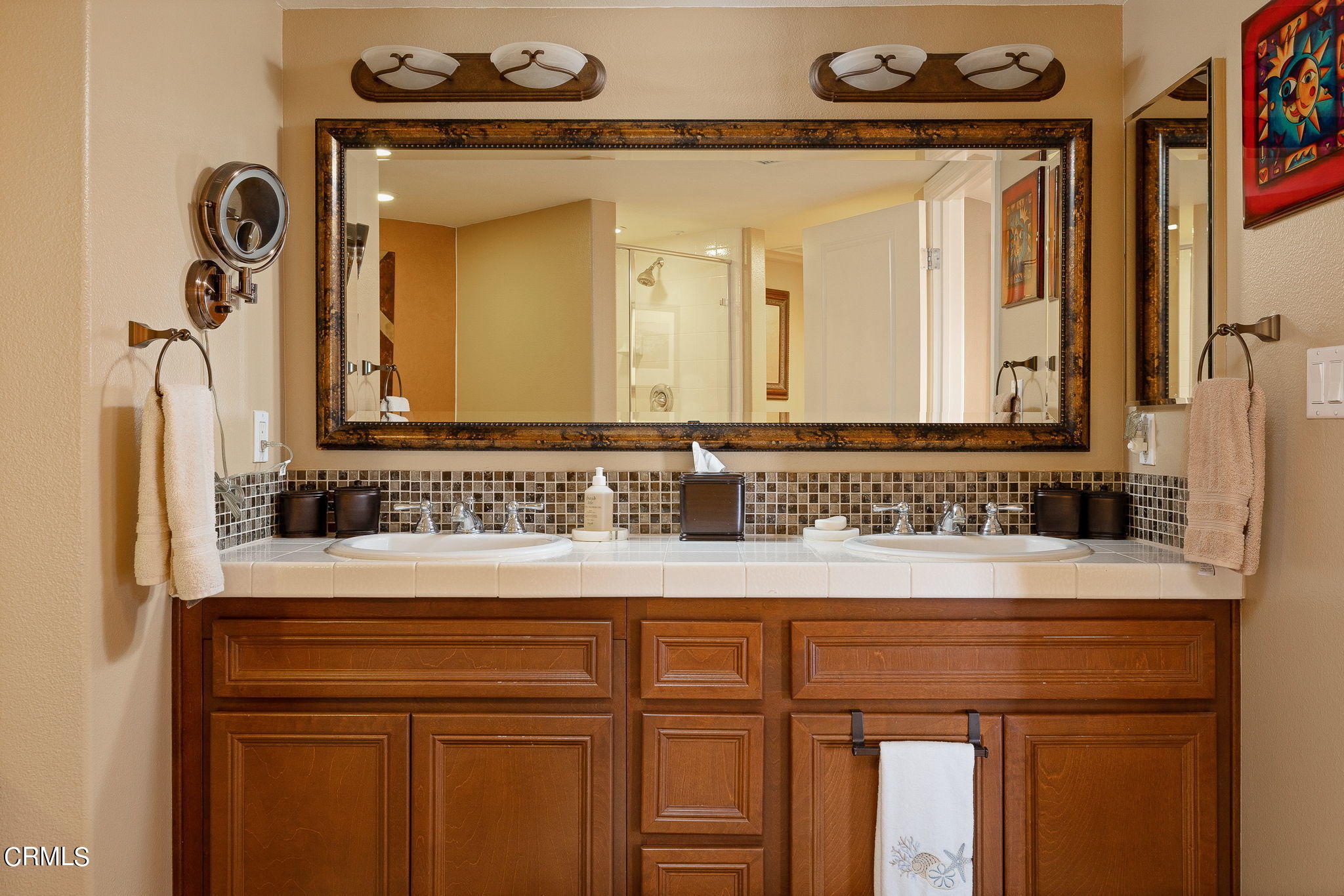 4288 Tradewinds Drive Oxnard, CA 93035 - Photo 24 of 42 a bathroom with a sink and a mirror