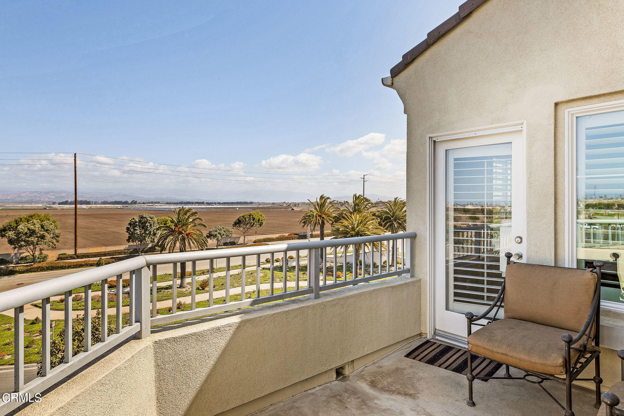 4288 Tradewinds Drive Oxnard, CA 93035 - Photo 27 of 42 a view of a city from a balcony with furniture