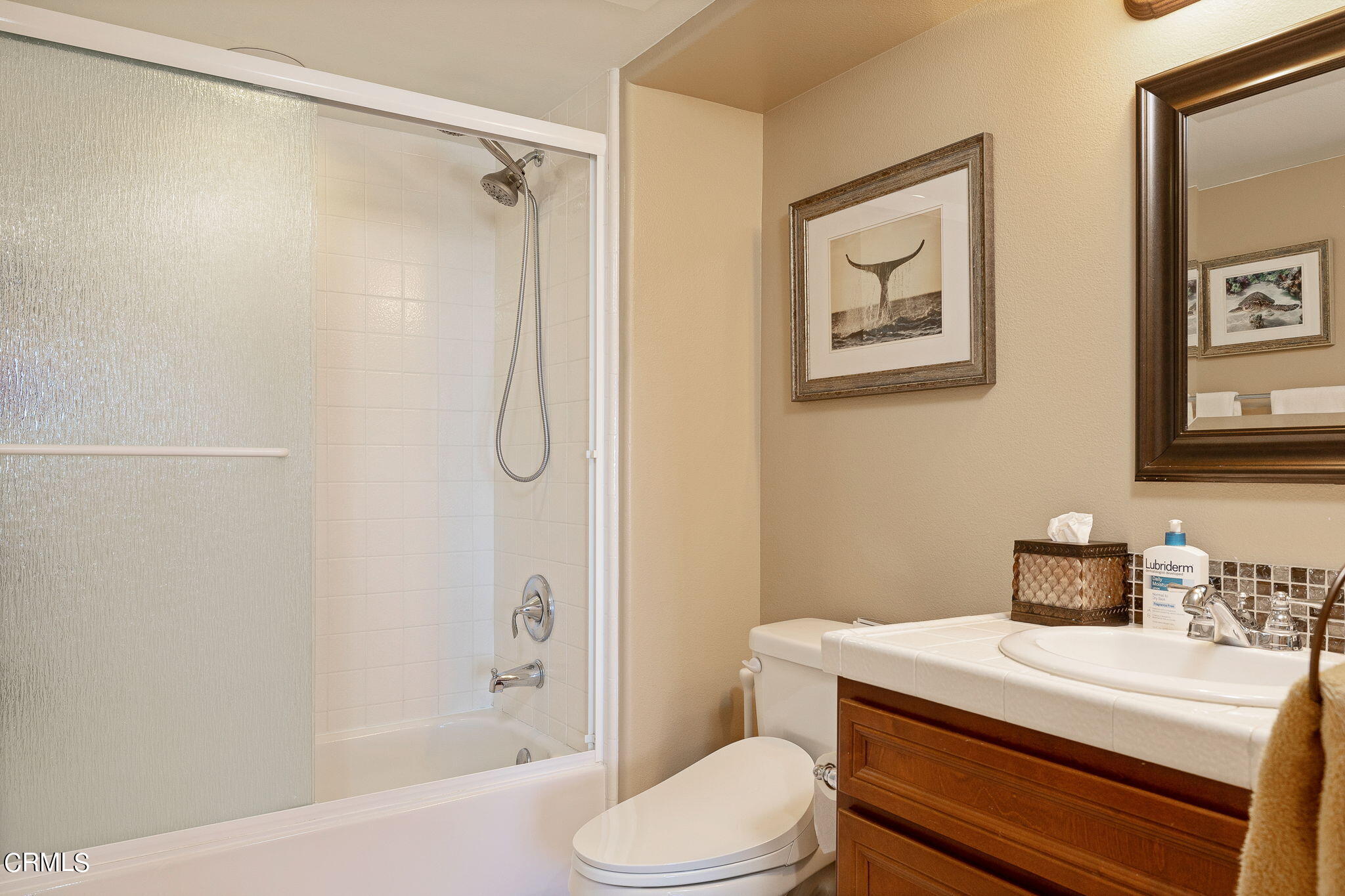 4288 Tradewinds Drive Oxnard, CA 93035 - Photo 31 of 42 a bathroom with a sink toilet and shower