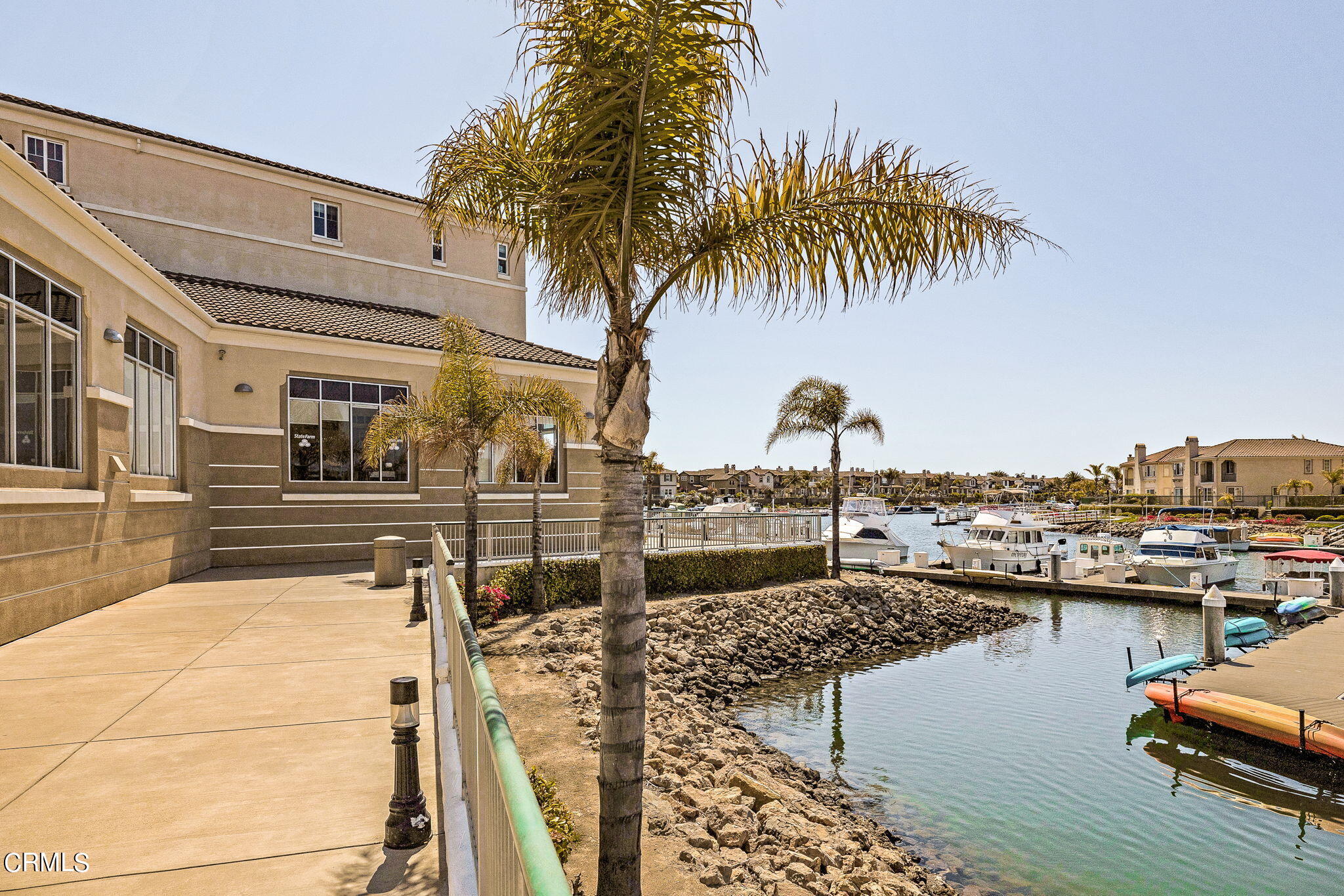 4288 Tradewinds Drive Oxnard, CA 93035 - Photo 38 of 42 a view of a swimming pool with a chair and tables